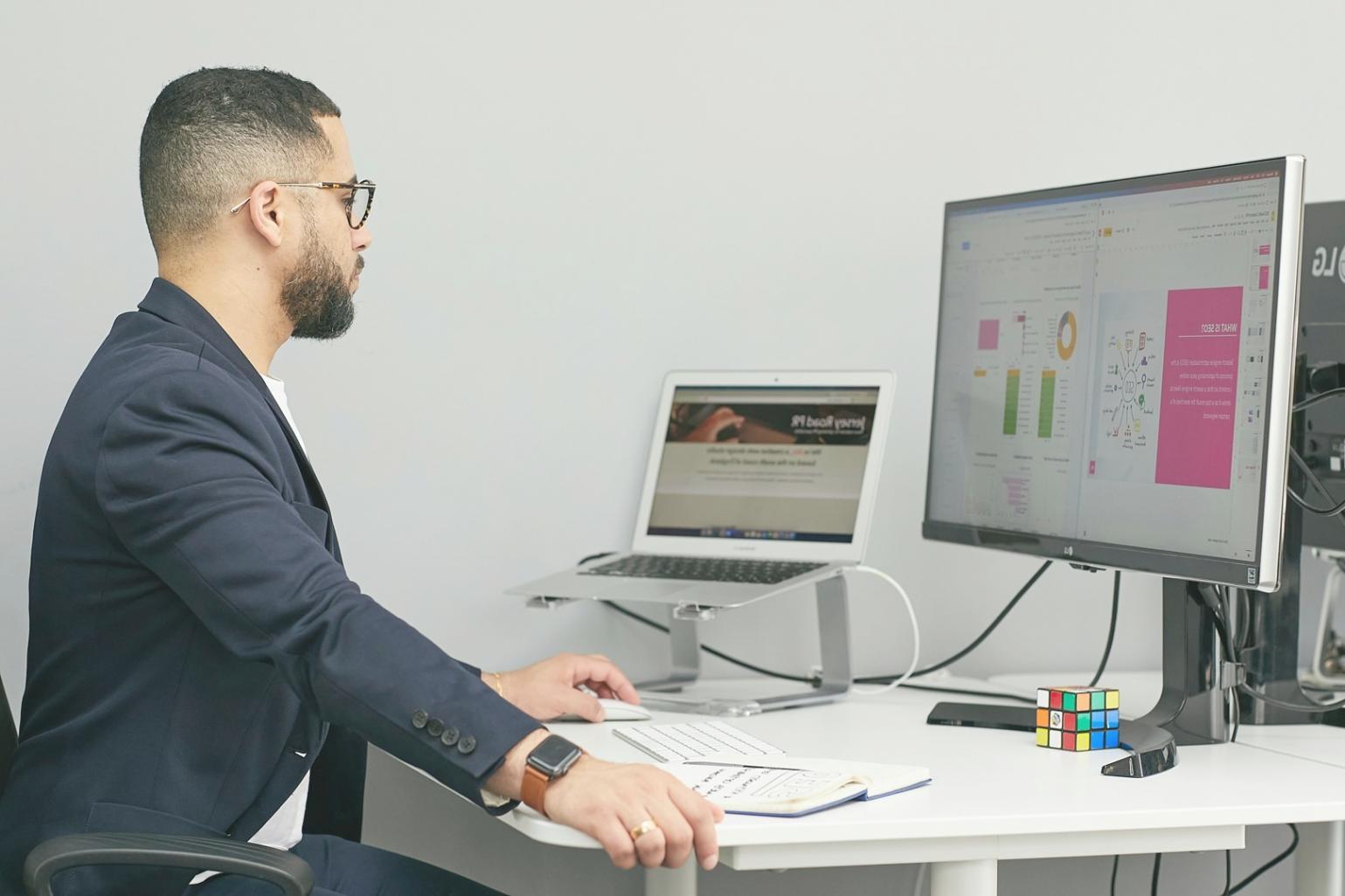 Professional financial analysis workspace with charts and data visualization displays showing market trends and industry metrics
